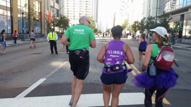 The coaches motivating Diana at mile 25.